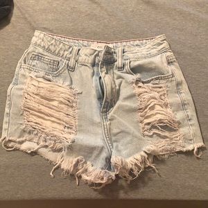 High waisted jean shorts with rips. Cello brand